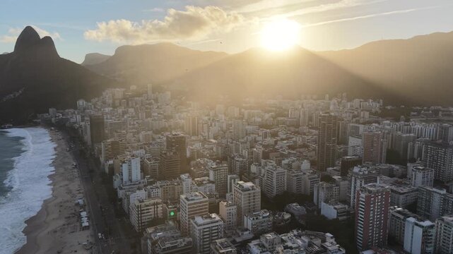 Ipanema, Rio de Janeiro, golden hour, sunset, dusk, late afternoon, beach, ocean, sea, coastline, shoreline, waves, skyline, buildings, apartment buildings, urban beach, beachfront, residential towers