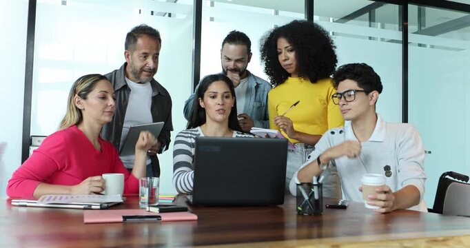 latin business teamwork having a discussion and working in an office in Mexico Latin America, group of hispanic coworkers at workplace