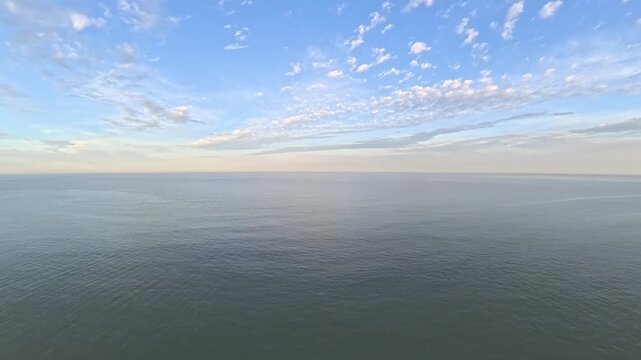 4K Aerial Drone Footage of Calming Open Ocean Waves at Dusk Landscape