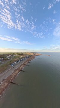 9:16 Vertical 4K Drone Aerial: Old Felixstowe Seafront and Shingle Beach at Sunset