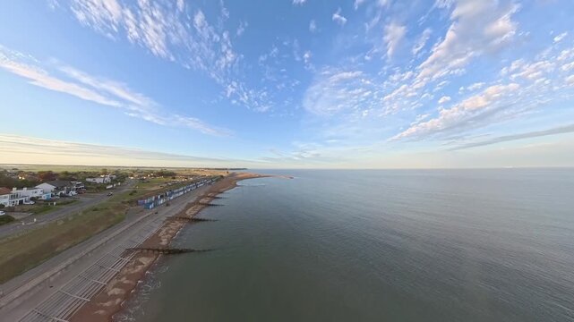 4K Drone Aerial View: Old Felixstowe Seafront and Shingle Beach at Golden Hour