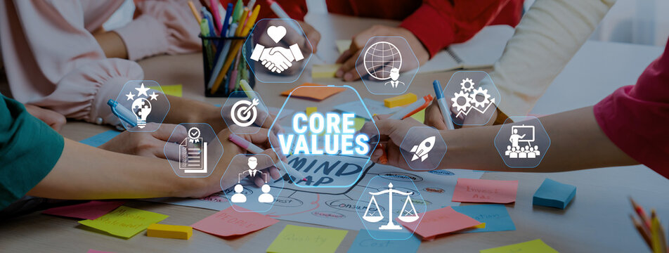Group of Diverse People Collaborating on Mind Map with Icons Representing Core Values, Creativity, and Teamwork in a Bright Office Environment Fluxor.