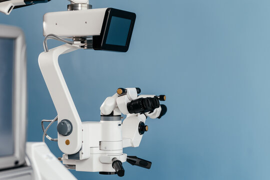 Advanced ophthalmic microscope system with empty display for copy space in a sterile operating theatre. Professional medical equipment designed for cataract surgery, eye microsurgery 