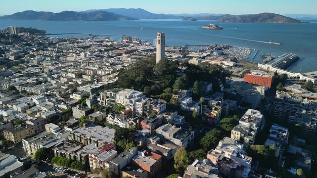 Cinematic drone footage orbiting around Coit Tower on Telegraph Hill in San Francisco. Smooth aerial movement showcasing the iconic Art Deco landmark.
