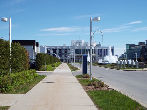 Gatineau,Quebec, Canada &ndash; May 15, 2026: A sidewalk leads toward "casino lac leamy", which features a prominent fountain and modern urban landscape elements at 1 Bd du Casino.