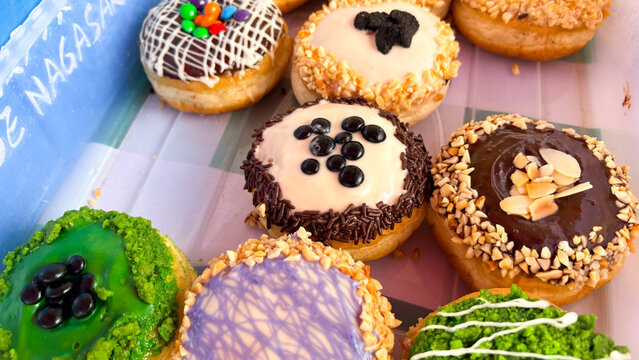 Assorted Gourmet Donuts with Colorful Glaze and Various Toppings