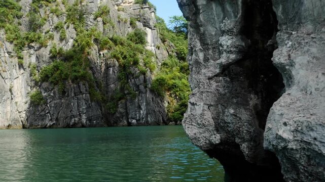 Sailing past some of the many tropical islands of Halong Bay Vietnam.