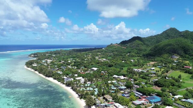 A drone view of Rarotonga,Muri Beach. the capital of the Cook Islands.Beautiful ocean view of coastline with clear water and houses in the sun