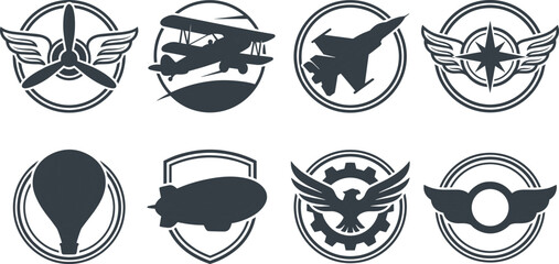 Set of vintage aviation and travel emblems featuring planes, airships, and heraldic wing designs © IconicCreations