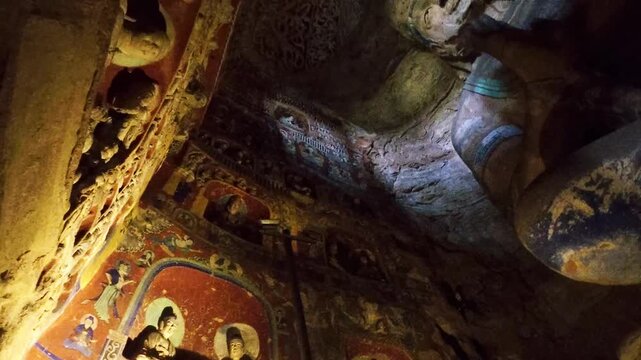 Yungang, China - May 9 2026: Majestic Buddha statue in the Yungang Grottoes, embodying spiritual serenity, monumental artistry, and the rich heritage of ancient Chinese Buddhist culture