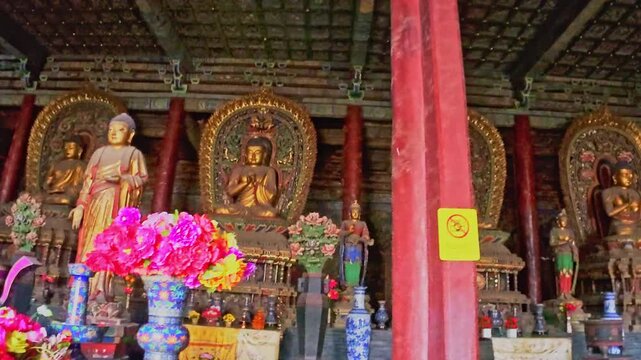Datong, China - May 9 2026: Ancient Buddhist sculpture in Huayan Temple, expressing spiritual serenity, exquisite craftsmanship, and the enduring legacy of Chinese Buddhist art