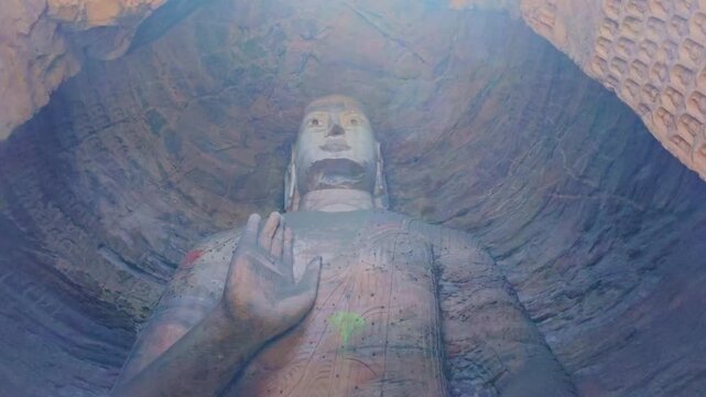 Yungang, China - May 9 2026: Majestic Buddha statue in the Yungang Grottoes, embodying spiritual serenity, monumental artistry, and the rich heritage of ancient Chinese Buddhist culture