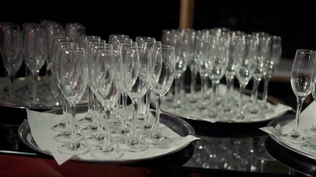 Many champagne glasses were ordered before being brought out to a party to be filled with champagne.