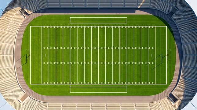 Aerial view of an empty American football stadium with green grass field and white markings.