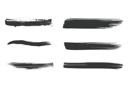 Black brush strokes on transparent background for design and art projects