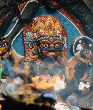 Ritual fire burning in front of Kaal Bairav statue at Kathmandu Durbar Square