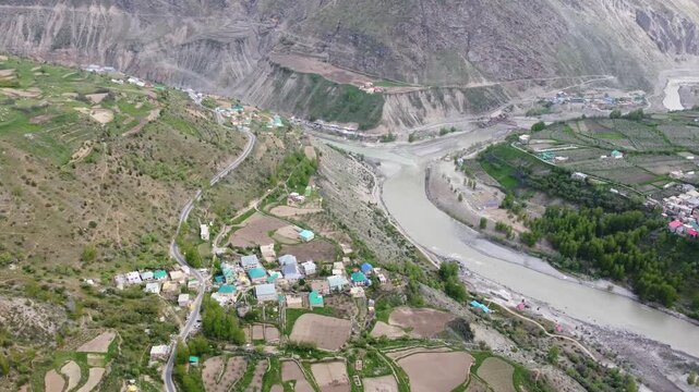 Aerial View of Himalayan River Flowing Through Mountain Valley in India