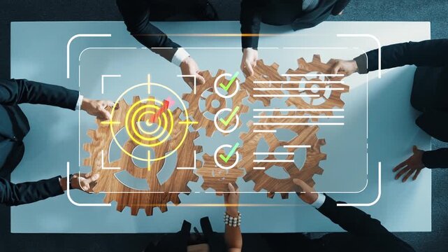 Business teamwork and collaboration concept with gears and digital checkmarks demonstrating efficiency and project management in an office setting Gluon.