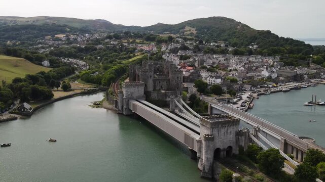 Aerial view of Conwy Castle with its historic stone walls and towers overlooking the river and the town of Conwy, Wales, United Kingdom.