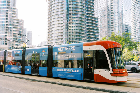 Toronto Canada - May 26 2026 Modern Streetcar with Advertisement in Downtown Urban Setting