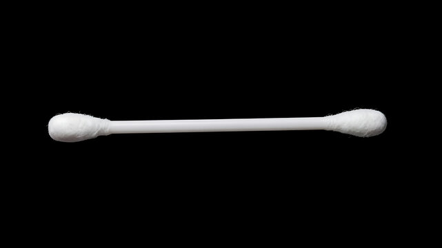 Single white plastic cotton bud swab isolated on a solid black background.