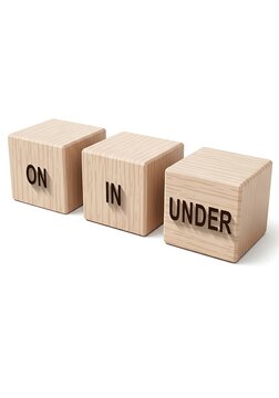 Wooden Blocks with ON IN UNDER Text for Learning and Education.