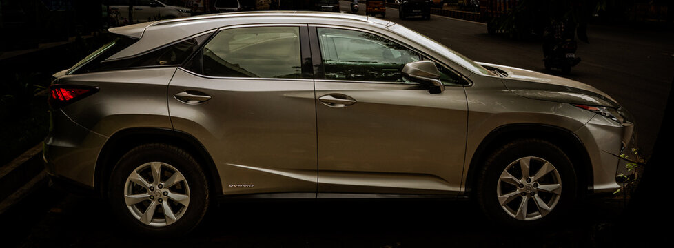 Lexus RX metallic gray hybrid model car. Lexus is the luxury vehicle division of the Japanese automaker Toyota Motor Corporation, headquartered in Shimoyama, Aichi, Japan since 2024. 