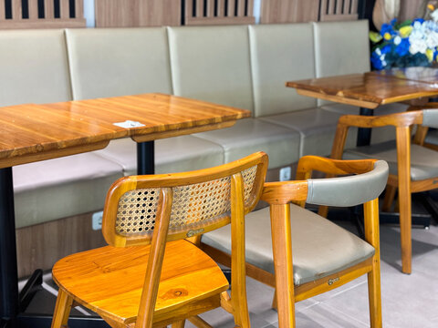 Rattan Backrest Wooden Chairs and Dining Tables in Modern Cafe Interior