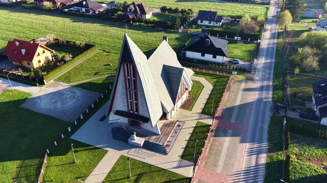 Drone shot of a church and residential area in daylight