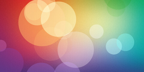 Abstract background with overlapping bokeh circles in rainbow colors creating soft festive atmosphere and textured light gradient. © rk