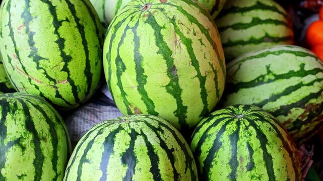 Fresh watermelons stacked at outdoor fruit market 180fps Captured in Cinematic High Detail Footage