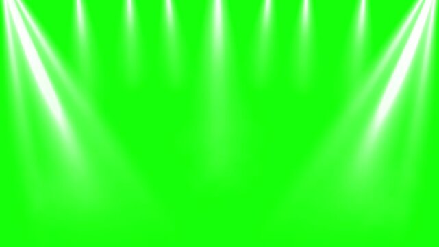 Stage spotlights with bright white beams on a green screen background for video editing