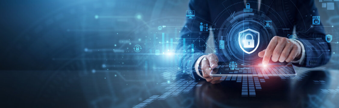 Cybersecurity defense network. Specialist using tablet to monitor threat detection and protect digital assets from breaches. Advanced network protection and secure infrastructure management.