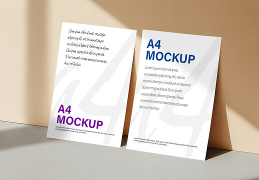 Dual A4 Poster Mockup Leaning on Wall with Warm Sunlight and Shadows