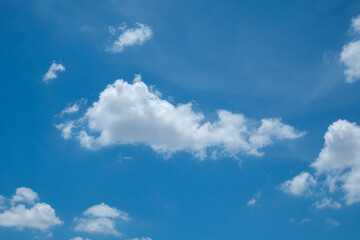 Fototapeta premium Beautiful blue sky with white clouds on a sunny day background