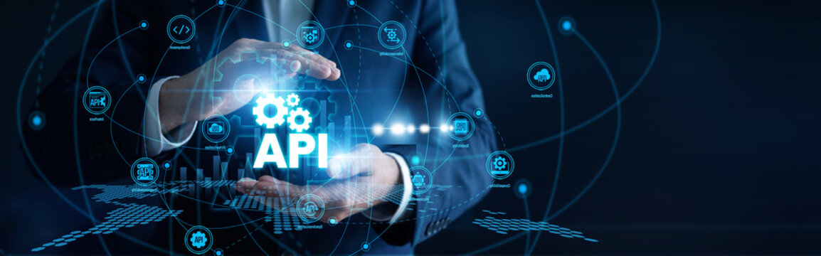 Software developer hands hold a device integrating a custom web API solution. Smooth software communication enables real-time data exchange between independent enterprise platforms.