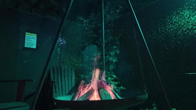 Cooking Over an Open Campfire in Nature, Outdoor Camping Food and Wilderness Adventure