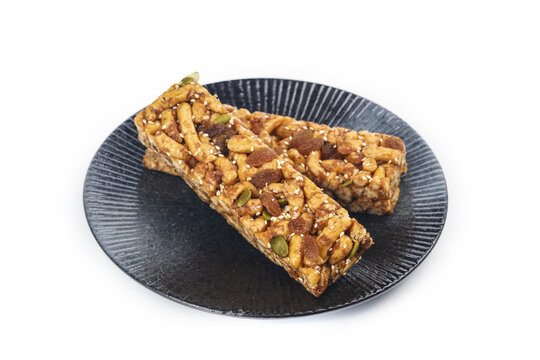 Traditional Chinese Sachima Nut Bars - Delicious Soft Sweet Snack on Dark Plate