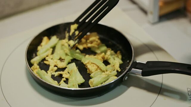 Stir Frying Celery with Scrambled Eggs in a Frying Pan, Healthy Home Cooking in 4K