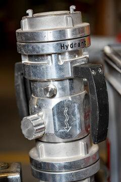 Fire Department Backflow Preventer Mounted on Hydrant Connection. Close-up of a backflow preventer used by a fire department on a hydrant connection to protect the public water supply. The device prev