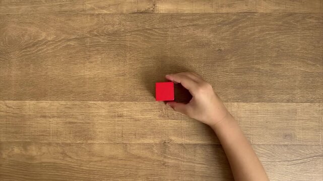 Child Hands Build a House Shape with Red and Blue Wooden Blocks, 4K