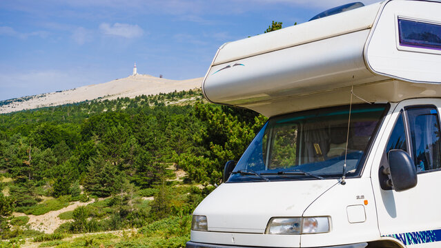 Caravan in mountains. Mont Ventoux in the distance. Provance in France