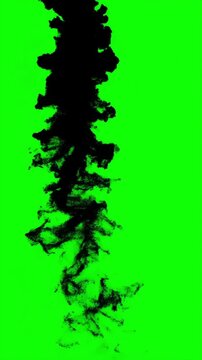 Black ink swirling and floating on a green screen background, vertical video featuring fluid motion, abstract liquid effects and chroma key compositing asset