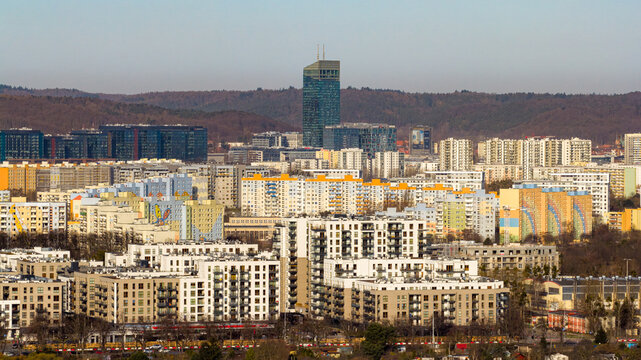 Gdansk, Poland - 28 March 2026: Aerial view of the Oliwa district featuring modern apartment blocks and the Olivia Star skyscraper against a backdrop of hills.