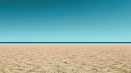 Fototapeta premium Vast golden sand meets tranquil blue ocean and clear sky