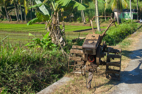 muddy hand tractor used for plowing agricultural paddy fields.