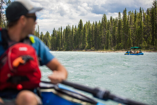 Over the shoulder view of a river rafting trip