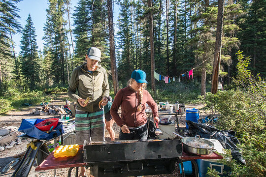 Couple makes a big breakfast at their campsite