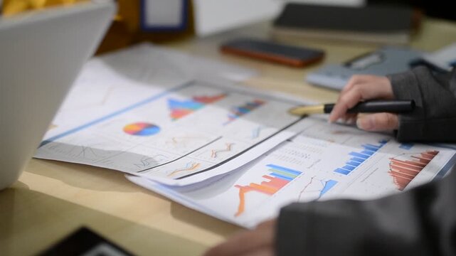 Human use calculator and calculate bills and paying bill, credit card, tax and vat, payment, concept of money management and business report with financial documents, financial accounting concept