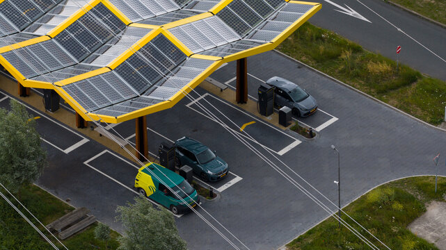 Muiden, Netherlands - 11 June 2026: Aerial drone view of a Fastned charging station, showcasing ultra fast electric vehicle charging, sustainable mobility and highway infrastructure.